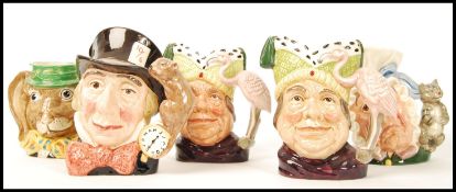 A group of five Royal Doulton character jugs to include Mad Hatter D6598 , Ugly Duchess D6599 x