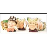 A group of five Royal Doulton character jugs to include Mad Hatter D6598 , Ugly Duchess D6599 x