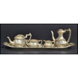 A 20th century miniature silver plated tea service consisting of tea pot, coffee pot, creamer and