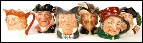 A group of Royal Doulton character jugs to include Old King Cole , Night Watchmen D6569 , Uncle