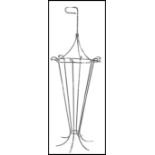 A vintage 20th century cast metal / wire work umbrella stick stand in the form of an umbrella having