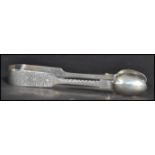A pair of 19th century Victorian sugar tongs bearing hallmarks for Exeter 1847 makers Robert and