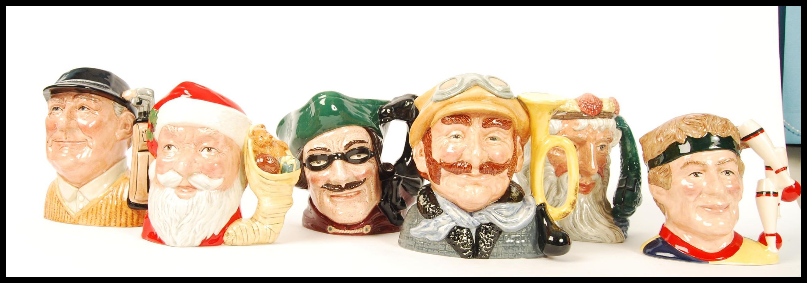 A group of six Royal Doulton character jugs to include Santa Clause D6690 , Dick Turpin D6528 ,