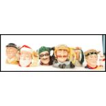 A group of six Royal Doulton character jugs to include Santa Clause D6690 , Dick Turpin D6528 ,