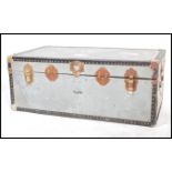 A vintage retro 20th century industrial storage steamer trunk having brass bound and lock.