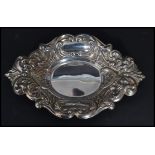 A 20th century silver hallmarked rococo style pin tray having scrolled and acanthus leaf decoration.