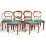 A set of six 19th century Victorian mahogany balloon back dining chairs having overstuffed seats