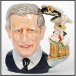 A Royal Doulton character jug depicting The Prince of Wales, Prince Charles D7283 , handle