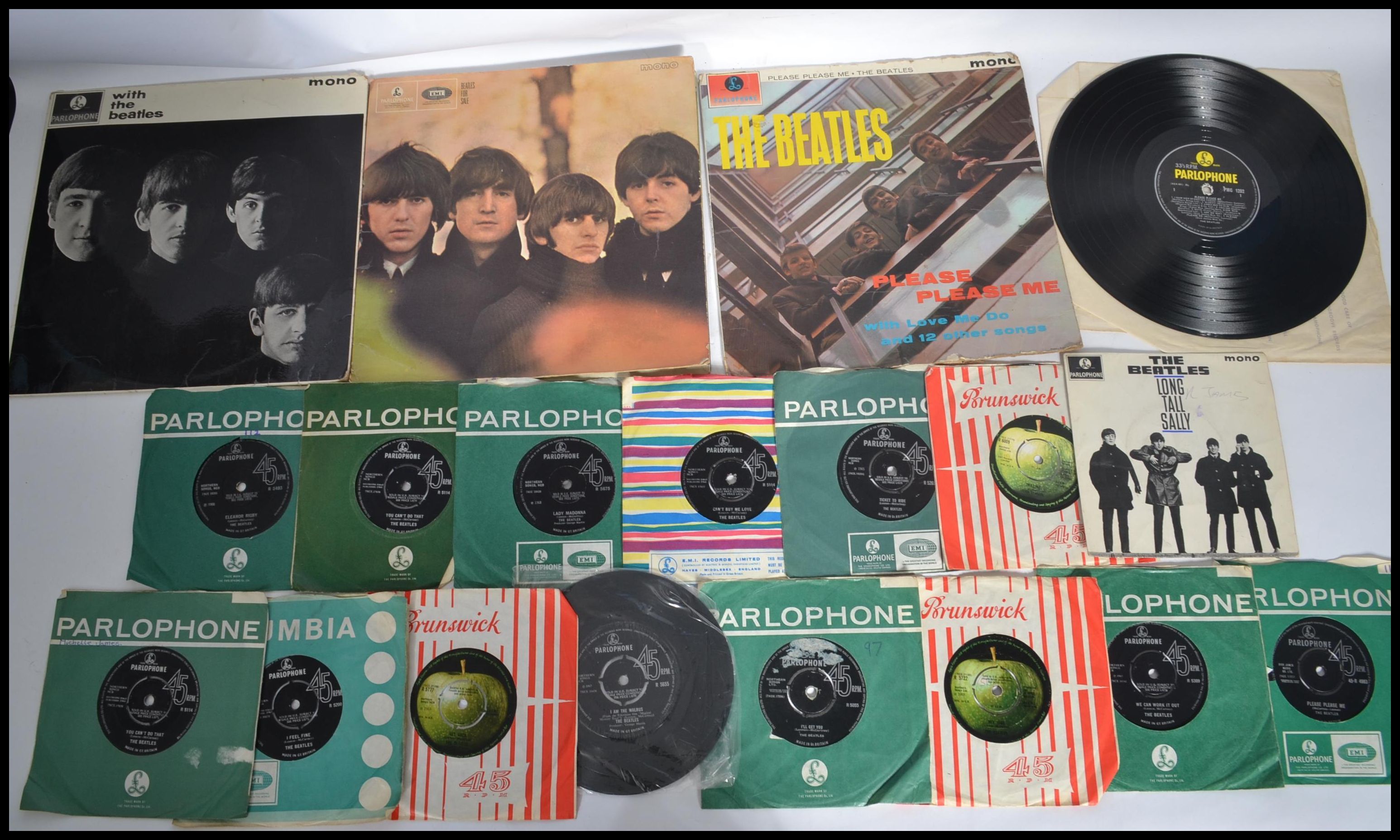 The Beatles A collection of vinyl long play LP records together with a selection of 7" 45rpm vinyl