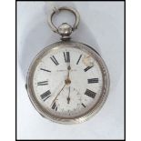 An early 20th century silver cased pocket watch part lever. The white enamel face with Roman numeral