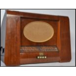 A vintage 20th century HMV His Masters Voice mahogany cased radio with oval grille dials and buttons