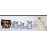 A collection of 19th century Victorian ceramics to include a Staffordshire fireside dog with inset