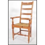 A 19th century Victorian  walnut ladderback  armchair being raised on turned legs united by