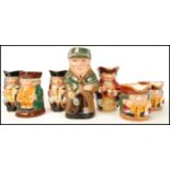 A group of seven Royal Doulton character Toby Jugs to include The Squire , Jolly Toby x2 , The