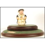 A Royal Doulton Limited Edition character Toby Jug Henry VIII D7047 237/2500 with two tier wooden