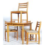 A contemporary late 29th century ash wood draw leaf dining table and chairs. The chairs with