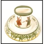 A Royal Doulton Isaac Walton Ware matchbox holder and matchstrike ashtray "Where In A Brook. With