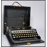 A vintage retro 20th century industrial portable typewriter by Remington. The Home Portable