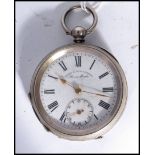 An early 20th century silver cased pocket watch by Henry E Peck Swiss made. The white enamel face