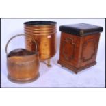 A large 19th century Victorian copper coal / log bin raised on paw feet along with a copper coal