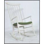 A vintage retro 1970's danish inspired ladder back rocking chair constructed from beech wood with