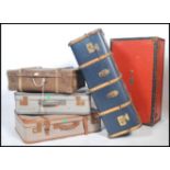 A collection of vintage 20th century steamer trunks and suitcases to include wooden bound steamer