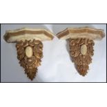 A pair of 19th century Victorian wall sconces / bracket shelves of scrolled form with serpentine