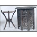 A 20th century Anglo Indian colonial foliate pierced and carved octagonal folding table made from