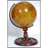 A 19th Century New Terrestrial Globe, published by H Collins of London, on a turned mahogany stand