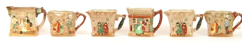 A group of six Royal Doulton embossed water jugs depicting Dickens scenes to include Peggotty ,