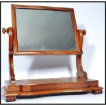 A 19th century  Victorian walnut swing frame dressing table mirror, the serpentine fronted base with