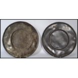 A pair of 18th century lead / pewter dinner plates, the plates of usual form with no noticeable
