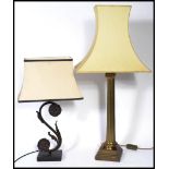 A large antique style brass roman columned table lamp with large shade together with a rococo