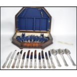 A good 20th century oak cased silver plated canteen of cutlery. Covers for six persons by