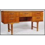 A retro teak wood 20th century sideboard / dressing table constructed with a series of drawers
