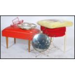 A collection of vintage mid century stools having red vinyl upholstery together with a mid century