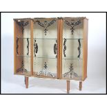 A vintage mid 20th century china / display cabinet. Raised on tapering supports with glass sliding