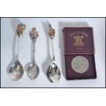 A pair of silver hallmarked and enamel Royal Silver Jubilee dessert spoons from a collection The