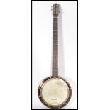 An early 20th century 4 string banjo musical instrument the head stock stamped no.45.