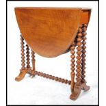 A 19th century Victorian walnut oval Sutherland table, moulded top, turned twin bobbin legs, ceramic