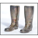 A pair of 20th century silver plated drinks measures in the form of gentlemans boots. Complete