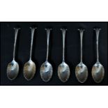 A set of six silver hallmarked shell tea spoons. The bowls in the form of shells with twist stems