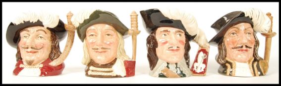 A set of four Royal Doulton character jugs to include Aramis D6441 , Porthos D6440 , Athos D6452 and