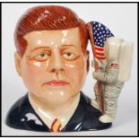 A Royal Doulton character jug depicting President John F Kennedy D7246, handle modelled as the the