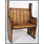 A good 19th century Victorian pine hall settle bench having pine slatted back rest with canted