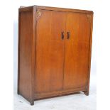 A 1930's Art Deco oak linen cupboard - cabinet having full length doors with shelved interior set