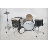 A child's 20th century full drum kit by Stagg to include everything from snare drum to cymbal,