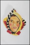An early 20th century Royal Doulton Jester wall mask plaque painted in vibrant colours. HN1673