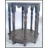 A Victorian carved oak 19th century centre / penny table. Raised on turned legs with octagonal