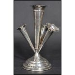 An early 20th century Edwardian silver hallmarked Epergne having a central fluted vase with three